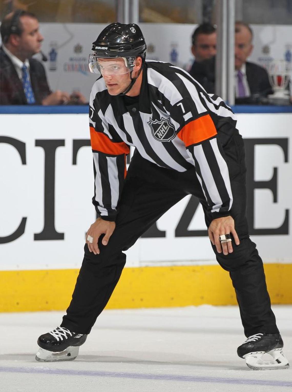 Referee Garrett Rank gets ready for a game between the Oilers and the Maple Leafs in November.