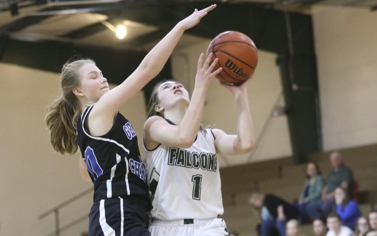 Greenville Christian's Lauren Wagner (20) tires to make the stop on Friendship Christian's Jessica Peterson (1). Coverage from the NCCSA Regional Tournament boys basketball game between the Friendship Christian Falcons and the Faith Christian Conquerors and the girls game between the Friendship Christian Falcons and the Greenville Christian Knights played in Raleigh, N.C. on February 17, 2017. The Friendship Christian girls defeated Greenville Christian 60-6 and the Friendship Christian boys defeated Faith Christian 56-36 to advance.