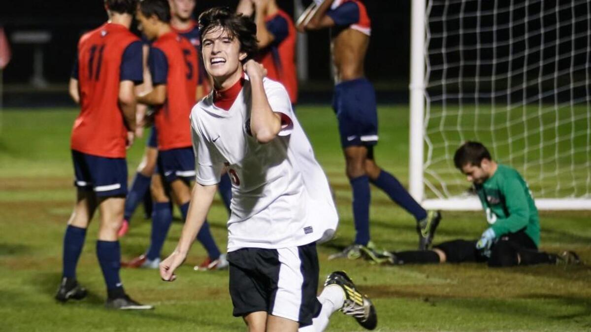 Middle Creek’s Hunter Hurst (5) celebrates a score late in the first half to put them up by four goals during Jordan's boys' soccer playoff game at Middle Creek on Wednesday, November 4, 2015. Middle Creek won the game 5-1.