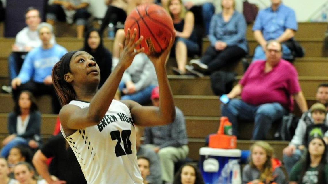 Green Hope's Nia Washington takes an open shot. The Green Hope Falcons and the Riverside Pirates girls and the Green Hope Falcons and the Panther Creek Catamounts boys played in the Triangle-6 4A Conference basketball tournament championships in Durham on Friday, February 16, 2018.