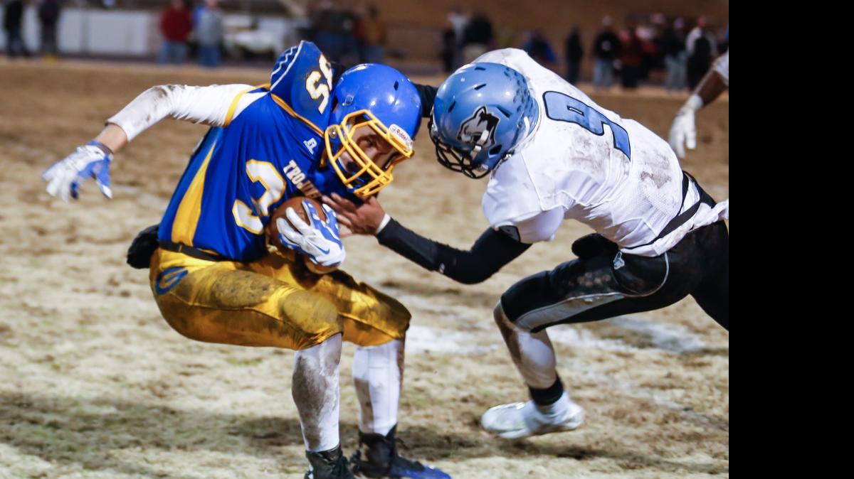 
Garner defensive back William Counts (35) shakes off a tackle attempt by Panther Creek receiver Dallas Hancock (9) after an interception during the Panther Creek playoff football game at Garner on Friday, November 28, 2014. Garner won the game 31-6.
