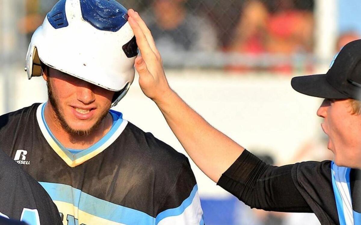 South Granville's Tucker Brown (6) congratulates teammate Justin Bullock after scoring a run during their 4-3 victory over the Edenton Holmes Aces in the the N.C. High School Athletic Association 2A East Finals at South Granville in Creedmoor, N.C. on May 26, 2016.