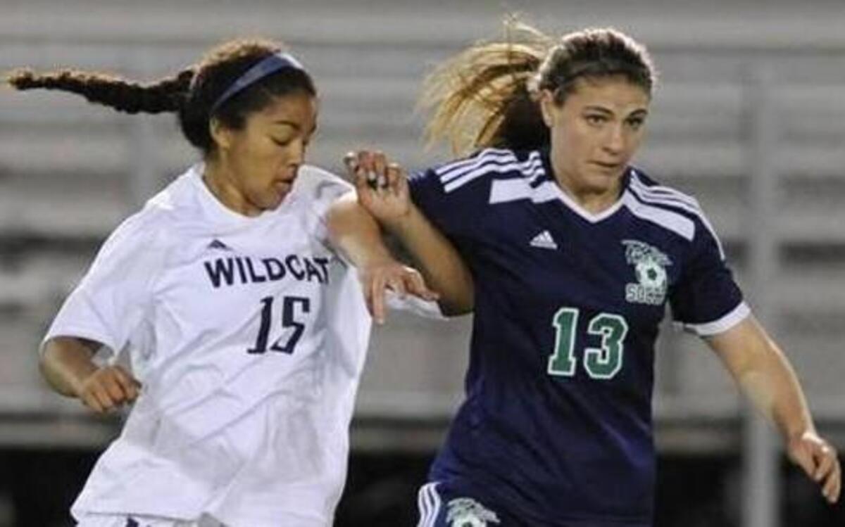 Millbrook’s Brianna Morris (15) and Leesville Road’s Anne Cawley (13) go after the ball earlier this season. Even after the loss to Wakefield, Leesville still looked forward to its match with Millbrook for Cap-8 rights.