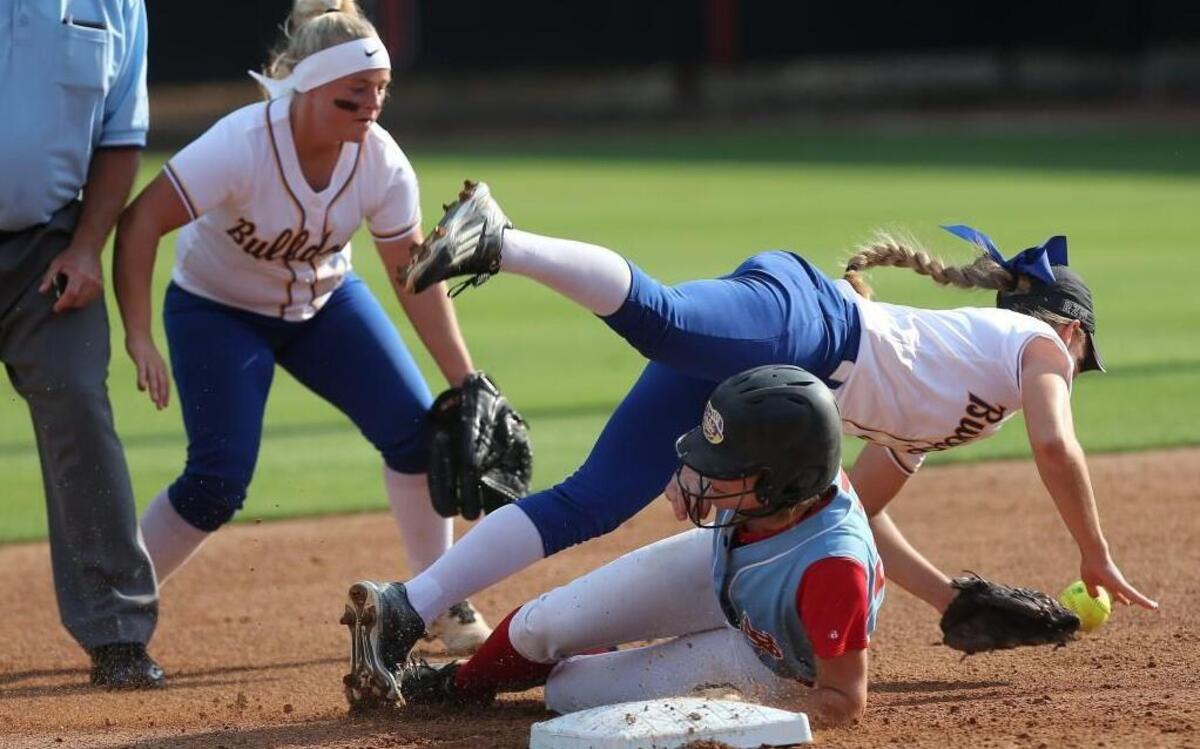 Princeton’s Taylor Carroll (6) falls over Alexa Sells (22) at second base during Game 1 of the N.C. High School Athletic Association 1A Softball Championship Series on Friday.
