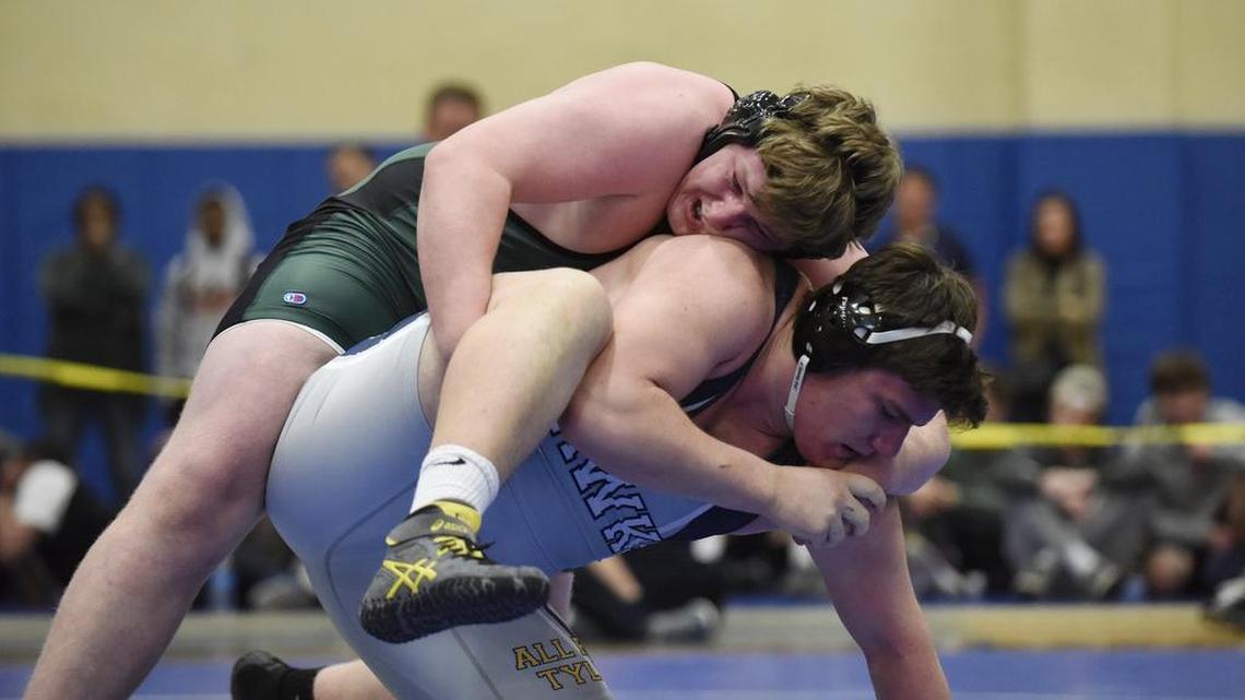 Ravenscroft's Calvin Atkeson wrestles Charlotte Latin's Harrison Karp in the 287 pound weight class at the NCISAA State Wrestling Tournament in Cary, N.C. on Saturday, February 18, 2017. Atkeson won.