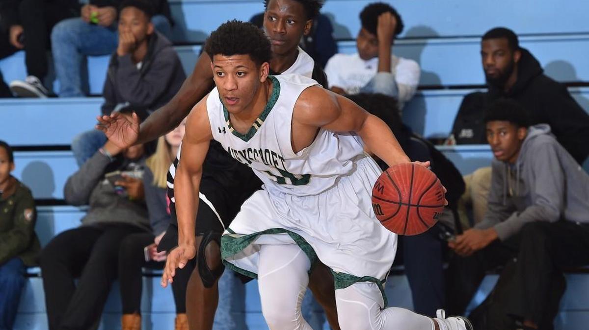 Ravenscroft's Elijah Sanders (30) drives along the baseline past Knightdale's Xavier Fennel (11). The final day of the 8th Annual South Granville Holiday tournament finals was held at South Granville High in Creedmoor, N.C. on December 30, 2017.