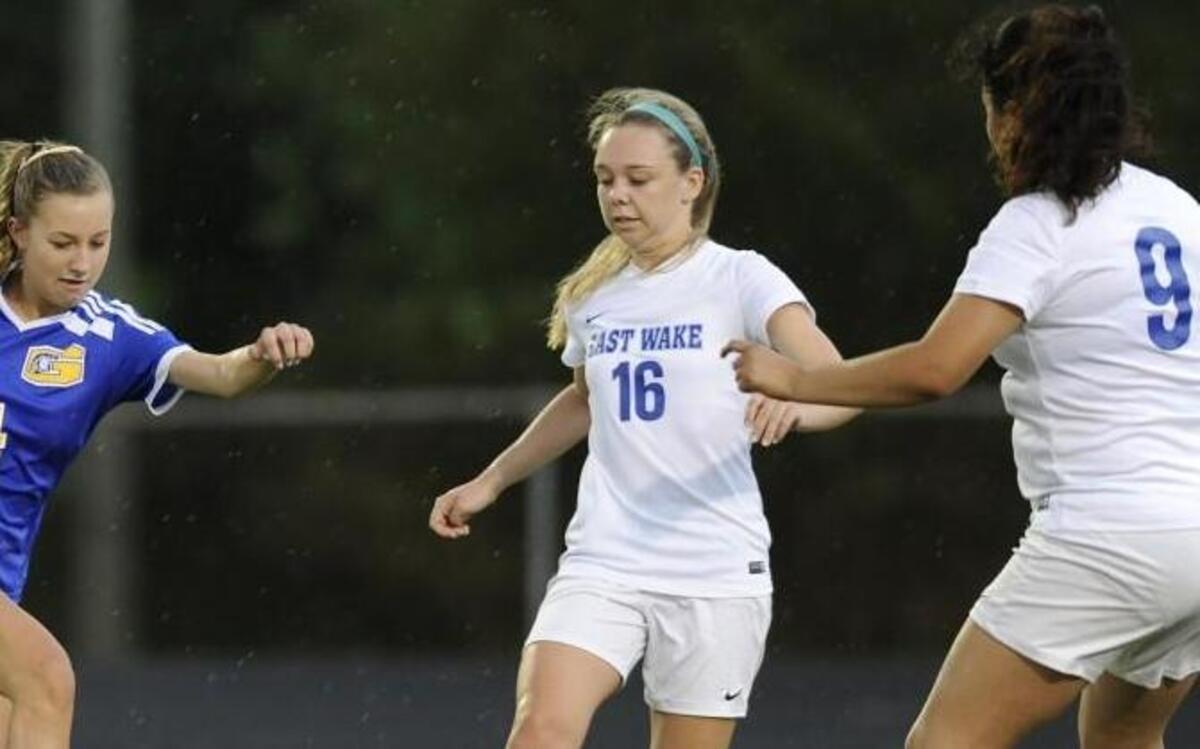 Garner's Riley Frechette (4) and East Wake's Alexa Bird (16) go after the ball in Wendell, N.C. on Monday, April 17, 2017. Garner won 3-0.