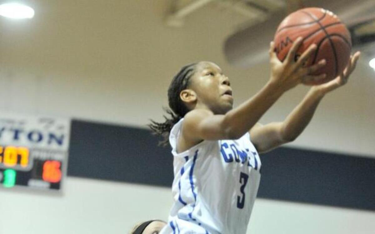 Clayton’s Janasia Gannon (3) drives to the basket against South Johnston’s McKinley Johnson (10).