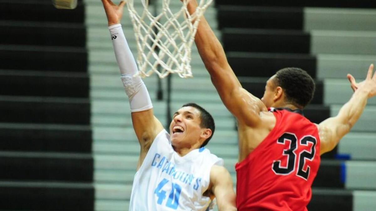Panther Creek’s Juan Munoz (40) banks a shot off the glass against Middle Creek's No. 32 on Wednesday, January 27, 2016. Panther Creek won 66-60.