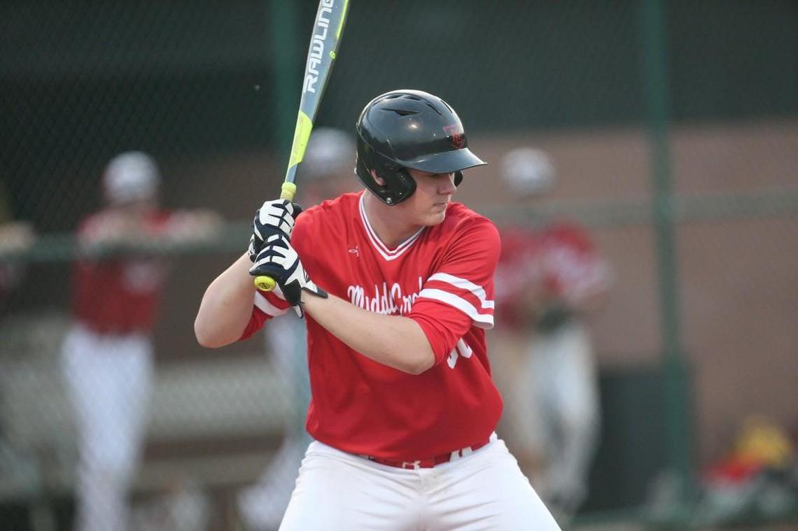 Middle Creek's Tucker Rogers (30) looks the ball in during the Fuquay-Varina Bengals high school game with the Middle Creek Mustangs high school , March 21, 2017, in Cary, N.C. Fuquay-Varina won the game . Fuquay-Varina won the game 7-1.