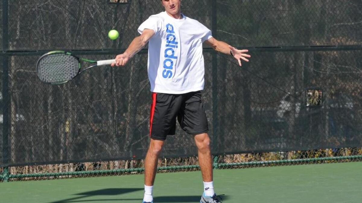 Green Hope's Ben Wayand returns a serve against Middle Creek during the boys tennis match, which was played in Cary on Thursday, March 17, 2016.