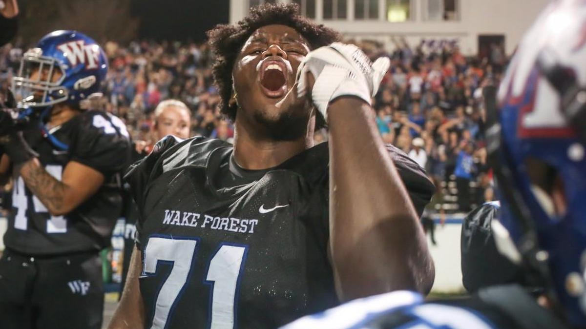 Wake Forest defensive lineman Jadacus Logan (71) celebrates as time runs out in the game. The Heritage Huskies visited the Wake Forest Cougars in a high school football game on Nov. 3, 2017.