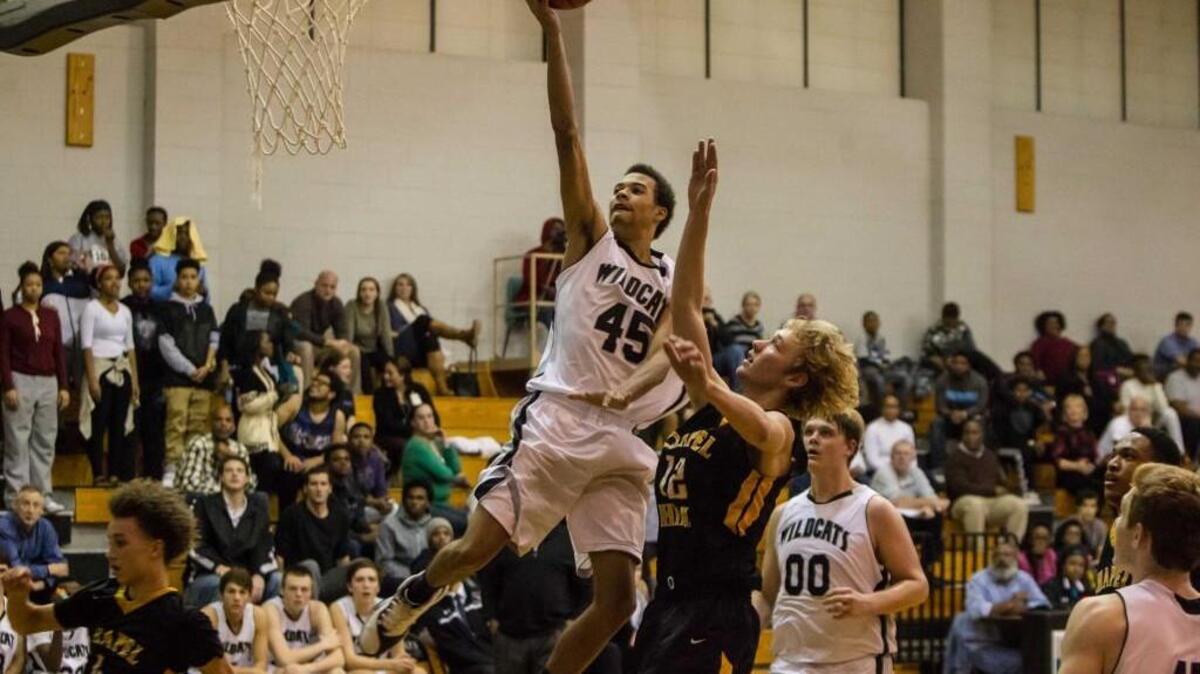 East Chapel Hill’s Andre Whitted finishes a fast break with a layup on Friday, December 4, 2015. East Chapel Hill defeated Chapel Hill 55-40.