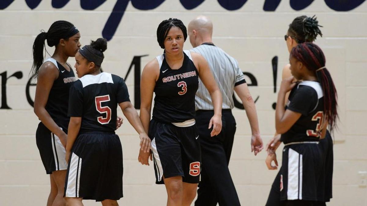 J'Naya Ephraim (3) of Southern Durham is congratulated by her teammates after scoring for the Spartans. The Hillside Hornets and the Southern Durham Spartans played in the Big Eight 3A Conference girls basketball tournament championship on Feb. 16, 2018.