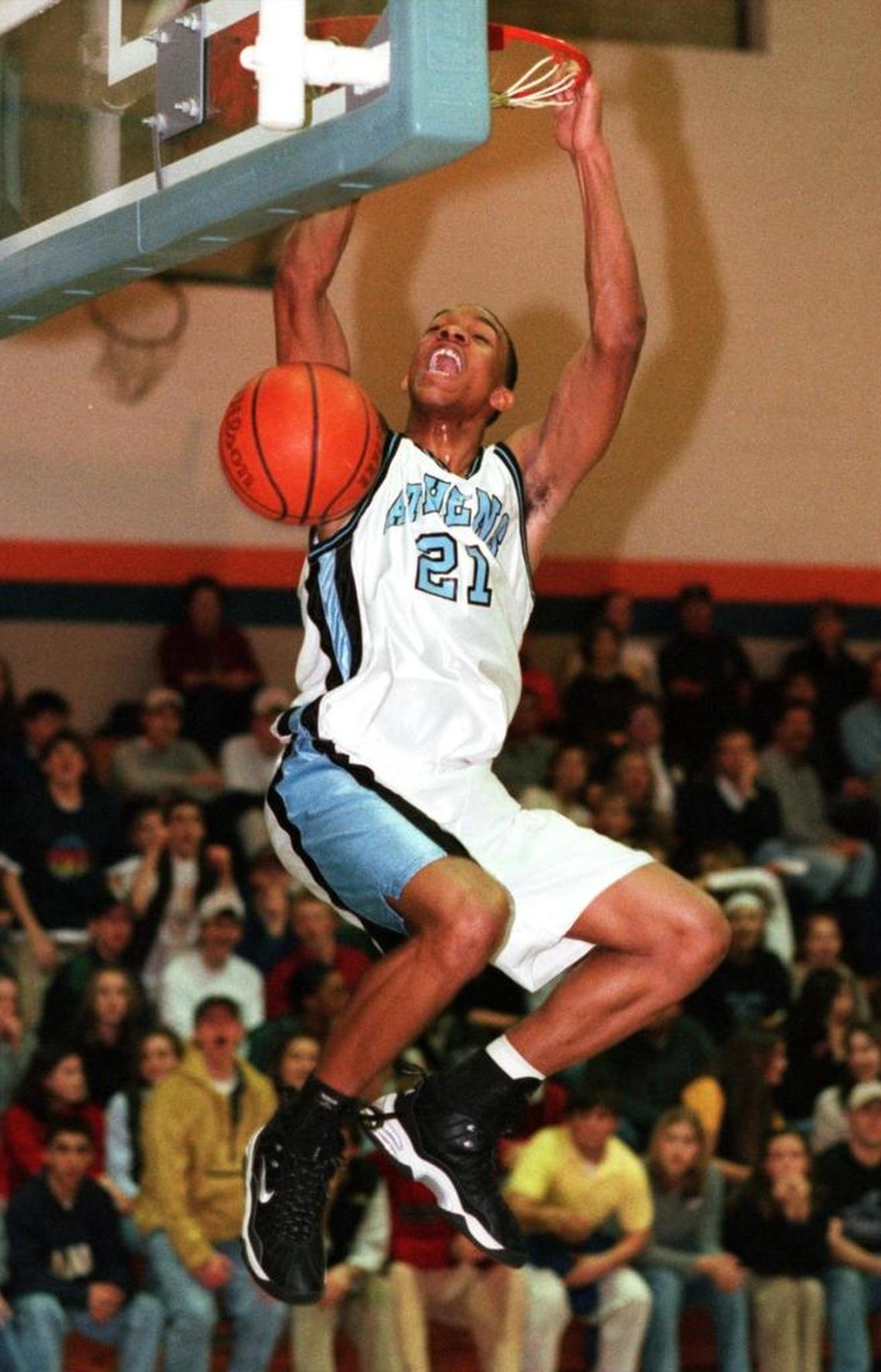 Shawn Ray of Athens Drive high school dunks the ball uncontested during a match-up with Lee County high school Friday night.