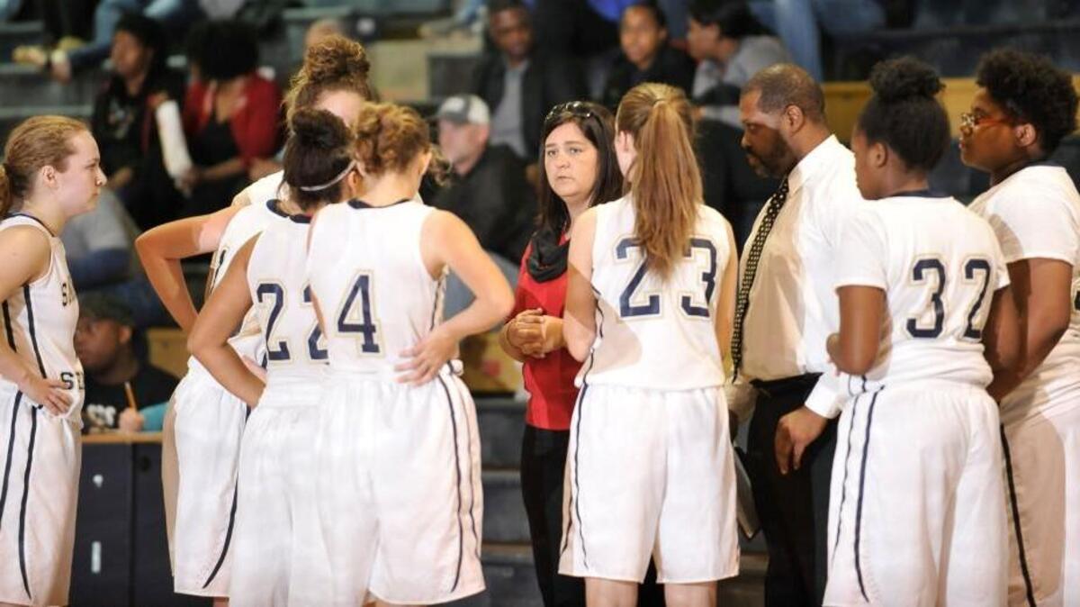 Smithfield-Selma head coach Stacy Holland talks to her team during a loss to Corinth Holders.