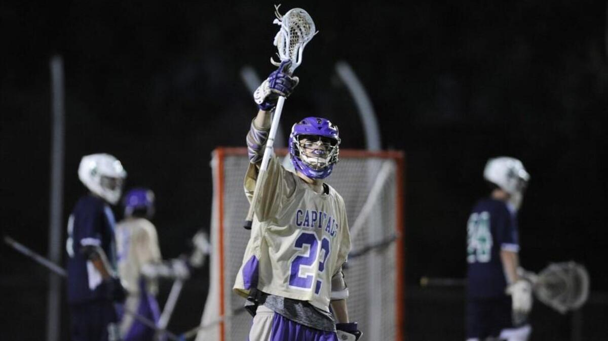 Broughton's David Liggett (22) celebrates defeating Leesville Road in Raleigh, N.C. on Monday, April 25, 2016. Broughton won 12-10.