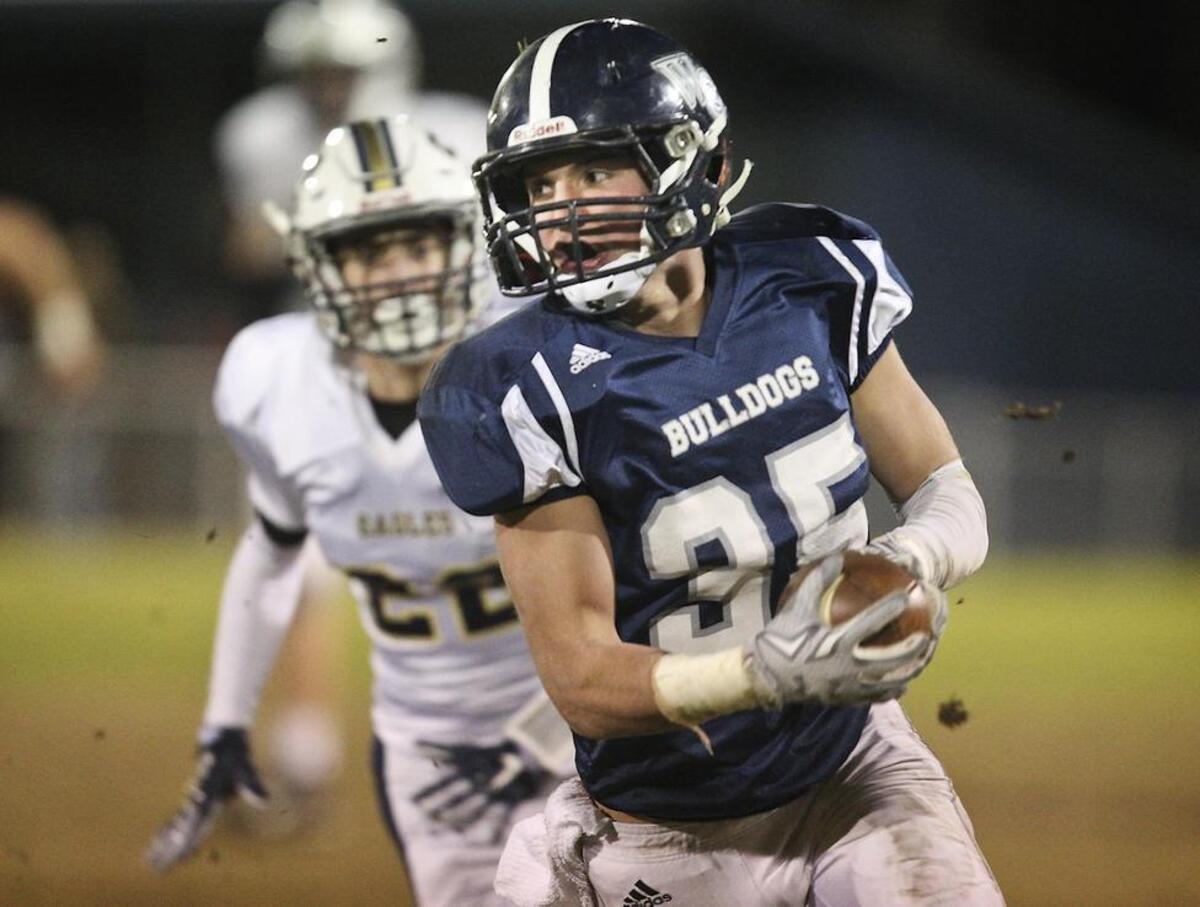 Wake Christain's Connor Collins (35) sweeps left end during the NCISAA Division III State Semifinals between Wake Christian Academy and Concord First Assembly Schools ,Friday, November 12, 2015, in Raleigh, N.C.Wake Christain leads at the half 16-0.