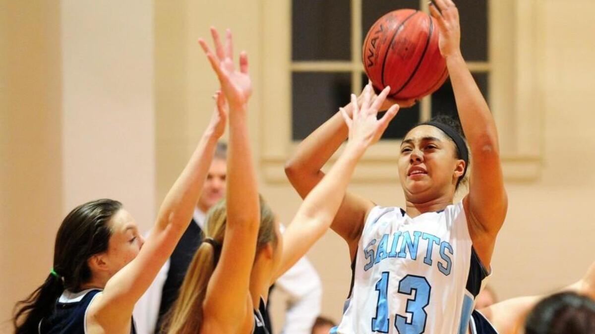 St. Mary’s School’s Andy Smithey (13) shoots over Wake Christian players during the girls’ basketball game on Tuesday. She led the game with 25 points, inching her closer to the 1,000-point mark.