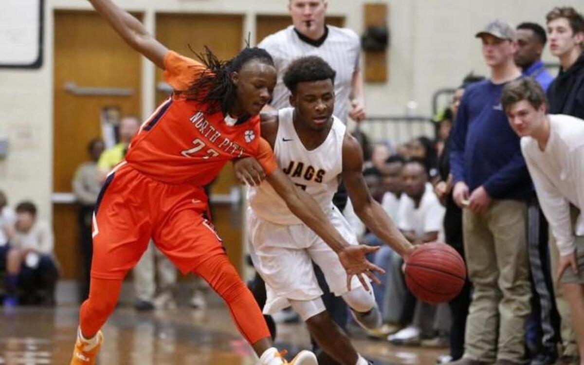 Farmville Central’s J. Harris (5) fouled by North Pitt's Reginald Carney (23) during the North Pitt High School boy's basketball game against Farmville Central High School High School in Farmville, N.C. on Friday, January 20, 2017.