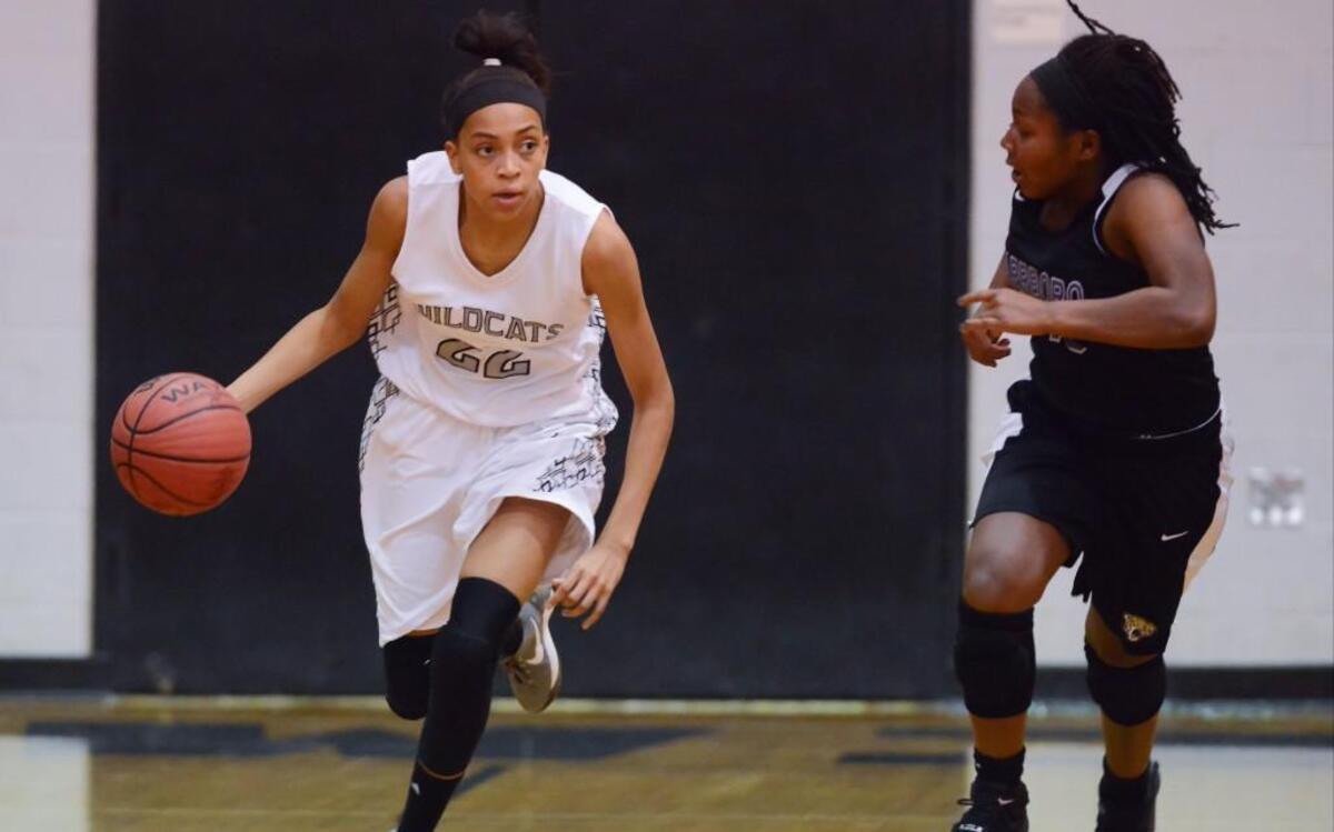 T.J. Johnson, left, of East Chapel Hill dribbles the ball against Gabrielle Adams, right, of Carrboro. The East Chapel Hill Wildcats played the Carrboro Jaguars in a women basketball game that took place in Chapel Hill, N.C. on Friday, December 16, 2016. East Chapel Hill won 38-30.