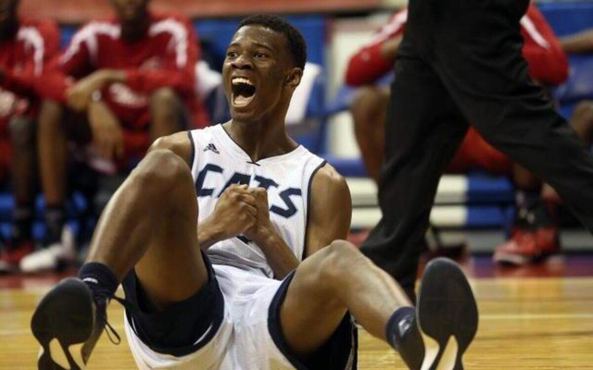 
Millbrook High’s Faison Brock celebrates his fall-away jumper going in after being fouled on the play on March 5 in Fayetteville.
