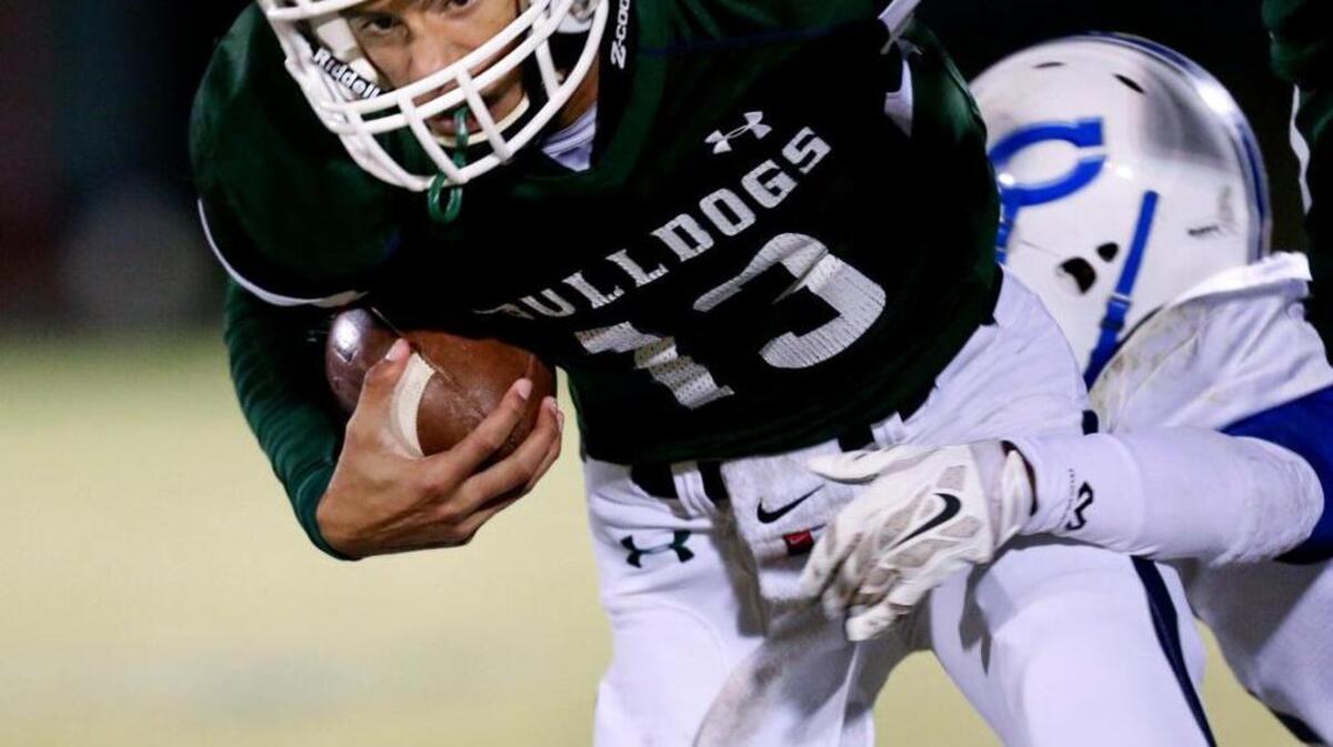 
Southeast's Dylan Parham (13) runs for tuff yardage 1during the Clayton High School Football game against Southeast Raleigh High School, November 7, 2014 in Raleigh, N.C. Southeast leads at the half 20-14.

