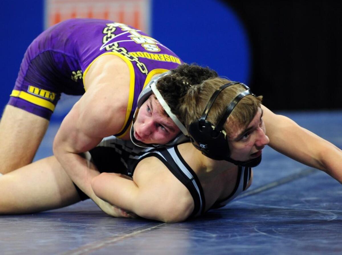 Rosewood's Tanner Smith (bottom) and Robbinsville's Christian Queen wrestle in the 145-pound class. The NCHSAA 1A wrestling championships took place in Greensboro on Saturday, February 3, 2018.