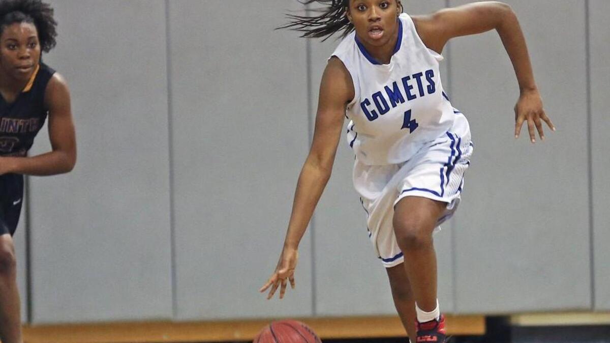 Clayton’s Shaniya Taylor (4) starts the break as the Comets switch to offense after a rebound. Coverage from the girls high school basketball game between the Clayton Comets and Corinth Holders Pirates played in Clayton, N.C. on January 5, 2016. Clayton defeated Corinth Holders 44-36.