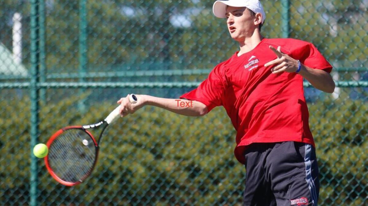 Nick Stachowiak during Athens Drive's tennis match at Middle Creek on Wednesday, March 18, 2015. Middle Creek won the match 8-1.