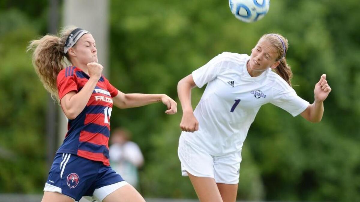 Natasha Turner, right, of Carrboro wins a header against Madison York, left, of Forbush. The Carrboro Jaguars played the Forbush Falcons for the NCHSAA 2A Women Soccer Championship Title in Raleigh, N.C. on Saturday, May 29, 2015. Carrboro won 2-1 after overtime.