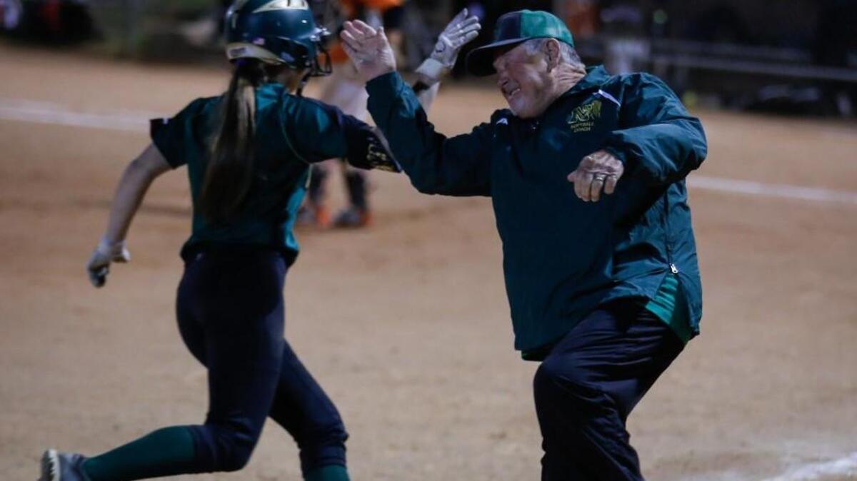 Northwood is the N&O’s top-ranked area softball team entering the playoffs. Northwood head coach Butch Edenfield high-fives Carson Shaner (9) as she rounds third base after hitting a homerun during Northwood's softball game at Orange on Friday, April 15, 2016. Orange won the game 5-4 in 9 innings.