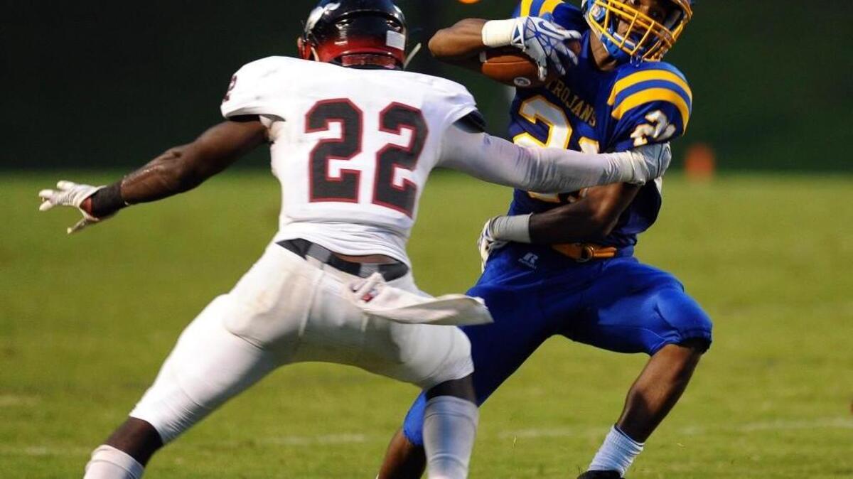 The Middle Creek Mustangs and the Garner Trojans seen here on Sept. 4, 2015, will be a conference rivalry starting in 2017.