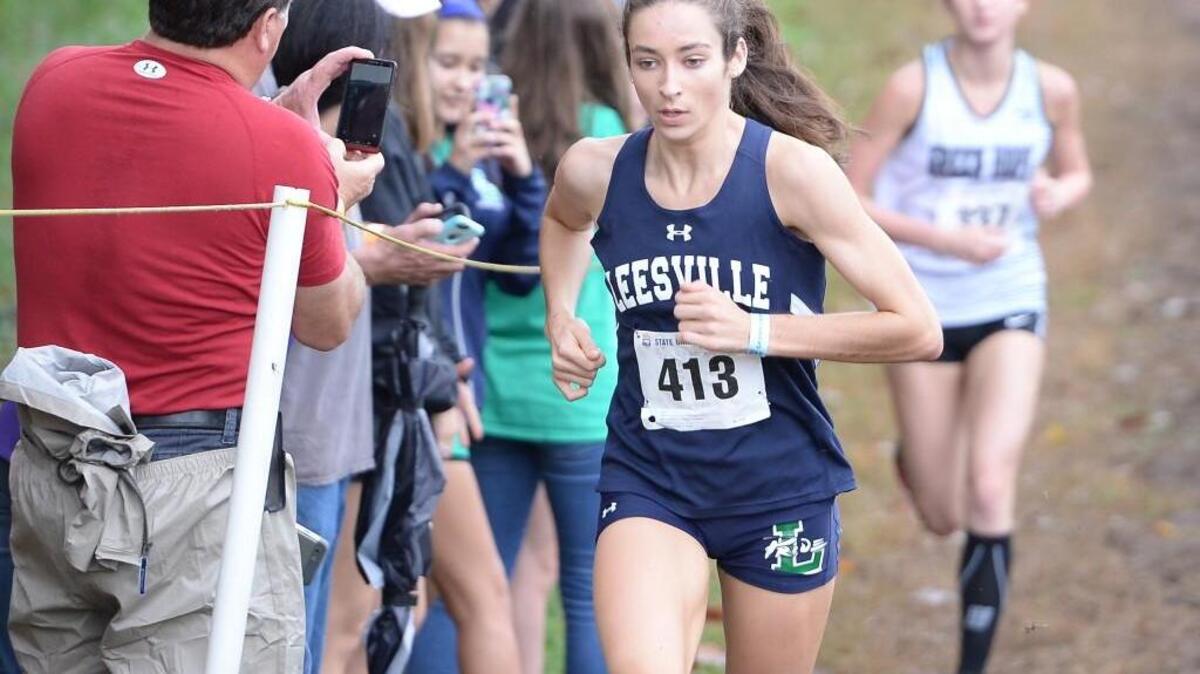 Nevada Mareno (413) of Leesville Road takes an early lead in front of Elly Henes of Green Hope during the 4A NCHSAA Cross Country Championships that took place at the Ivey M. Redmon Sports Complex in Kernersville, N.C. on Saturday, November 7, 2015.