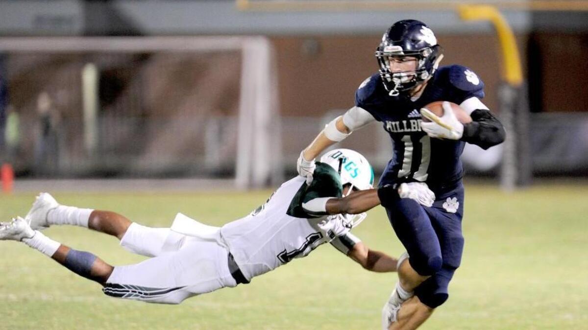 Millbrook's Tyler Snead (right) can't escape the flying tackle by Southeast Raleigh's Cinique Scott. The Southeast Raleigh Bulldogs visited the Millbrook Wildcats in a high school football game on Sept. 22, 2017.