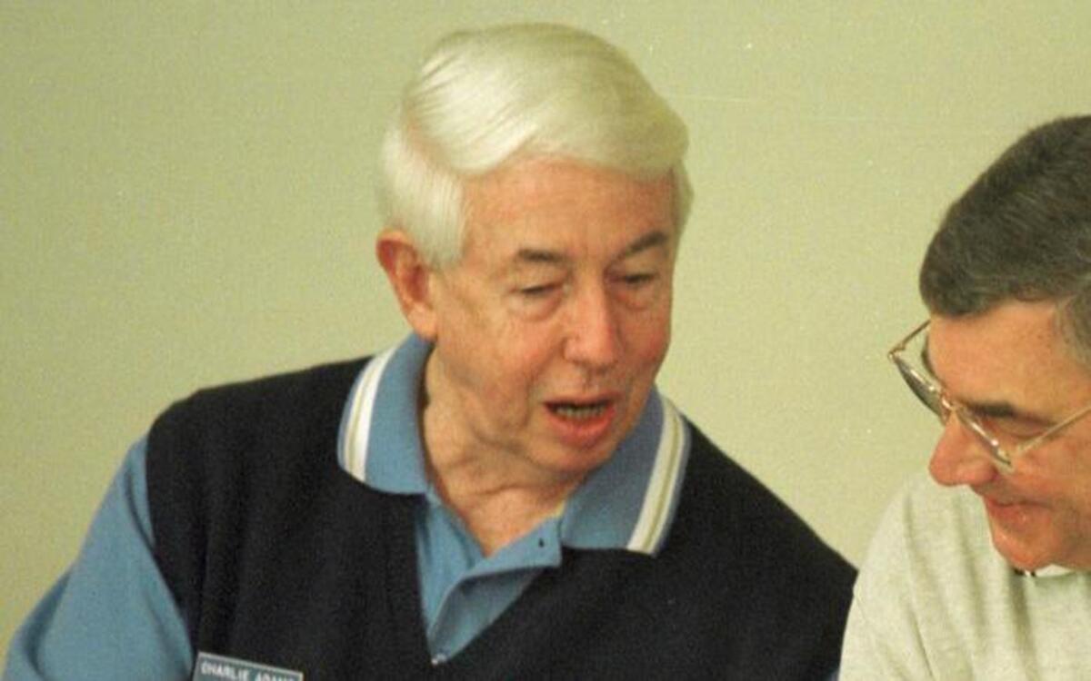NCHSAA executive director Charlie Adams, left, shares a light moment with visiting Bob Kanaby, right, executive director of the National Federation of State High School Associations on May 6, 1998 in Chapel Hill.