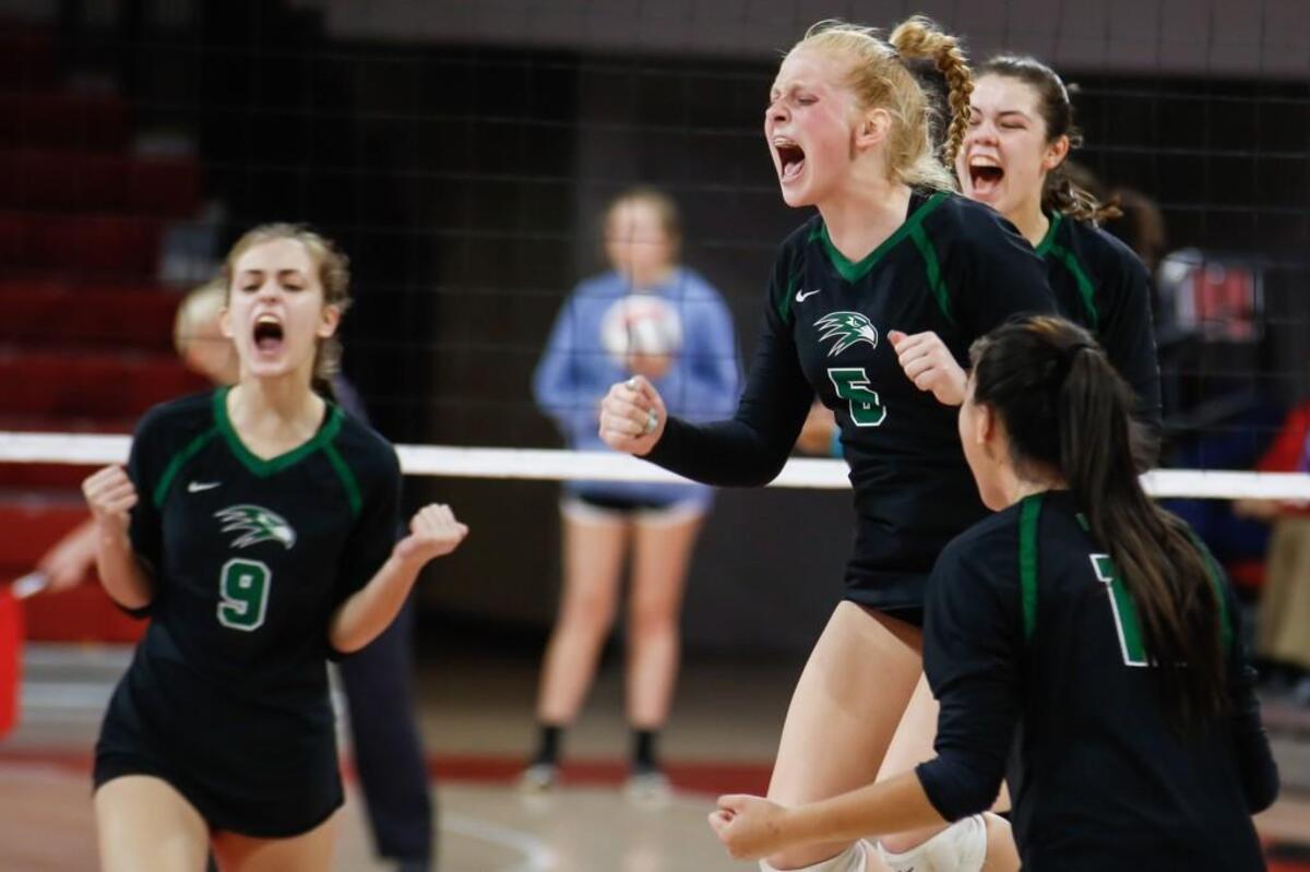 Green Hope's Sydney Dowler (5) celebrates a point with her teammates during Winston-Salem Reagan's NCHSAA 4A Championship volleyball game against Green Hope in Raleigh on Saturday, November 5, 2016. Green Hope won the championship 3-1, and Dowler was named tournament MVP.