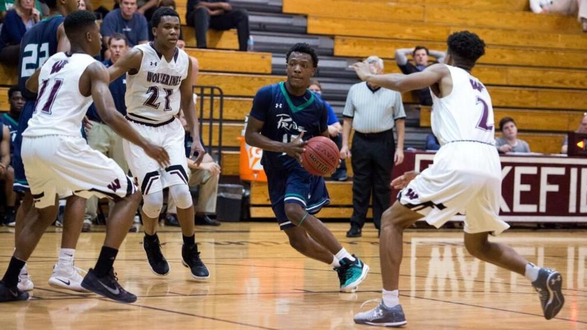 Leesville's D.J. Horne (10) drives hard to the basket during Cap-8 matchup between Leesville Road and Wakefield that took place at Wakefield High School on January 13, 2017 in Raleigh, North Carolina. Leesville Road girls win in a thriller against Wakefield by the score of 47-45. Leesville Road boys dominate Wakefield boys by the score of 85-68.