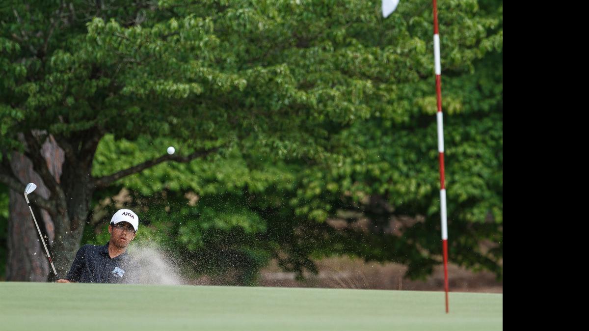 
Panther Creek’s Viraj Garewal plays this chip out of the right bunker on 12 during the NCHSAA 4A Men's Golf Championship at Pinehurst Country Club in Pinehurst, NC on Monday May 11, 2015.
