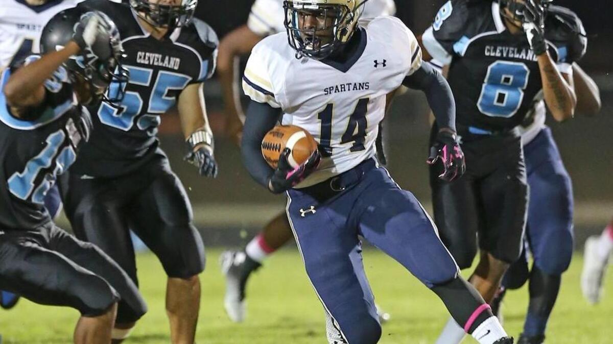 
Smithfield-Selma’s Raequan Smith (14) runs last season against Cleveland.
