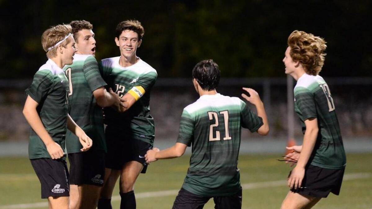 Cardinal Gibbons celebrates the second goal, from left to right, Jackson Hollenbach, Christopher Thorburn, Adam Trickett, Salvatore Bottone and Elijah Mizerk. The Heritage Huskies visited the Cardinal Gibbons Crusaders in the Wake County Cup championship high school soccer game on Sept. 23, 2017.