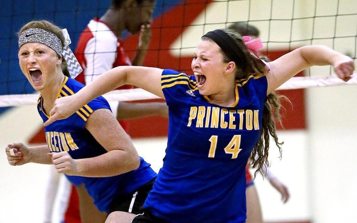 
Princeton's Hailey Wood (5) and Kelsey Peedin (14) react to a point win on the way back from a two-set deficit to eliminate Pender County in the 1A volleyball playoffs on Saturday.
