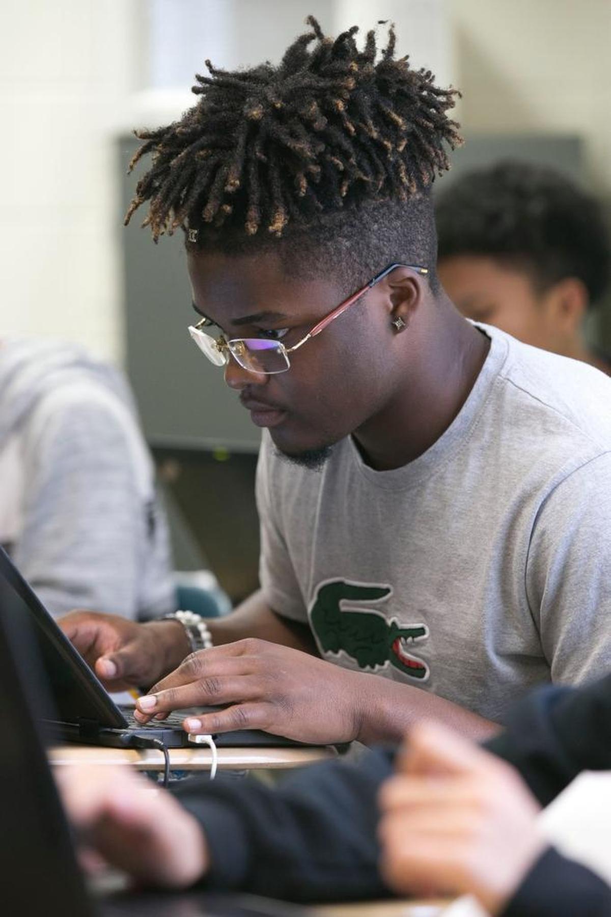 Jahmir Smith works on his laptop during Spanish class.