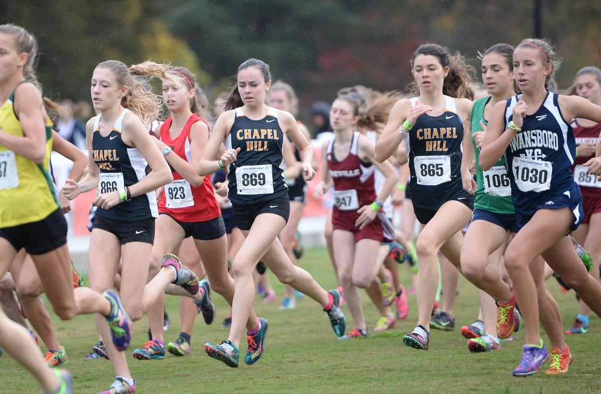 Katherine Dokholyan (866), Clare McNamara (869) and Marija Crook (865) of Chapel Hill during the 3A NCHSAA Cross Country Championships that took place at the Ivey M. Redmon Sports Complex in Kernersville, N.C. on Saturday, November 7, 2015.