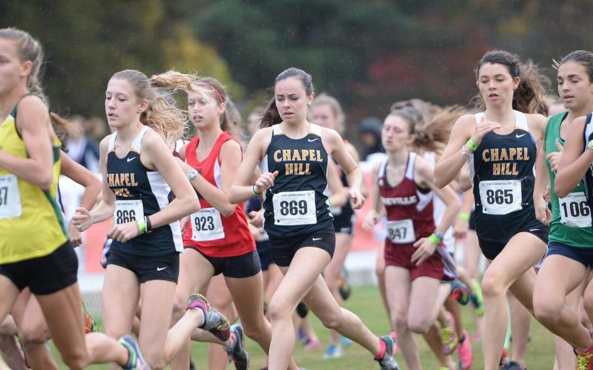 Katherine Dokholyan (866), Clare McNamara (869) and Marija Crook (865) of Chapel Hill during the 3A NCHSAA Cross Country Championships that took place at the Ivey M. Redmon Sports Complex in Kernersville, N.C. on Saturday, November 7, 2015.