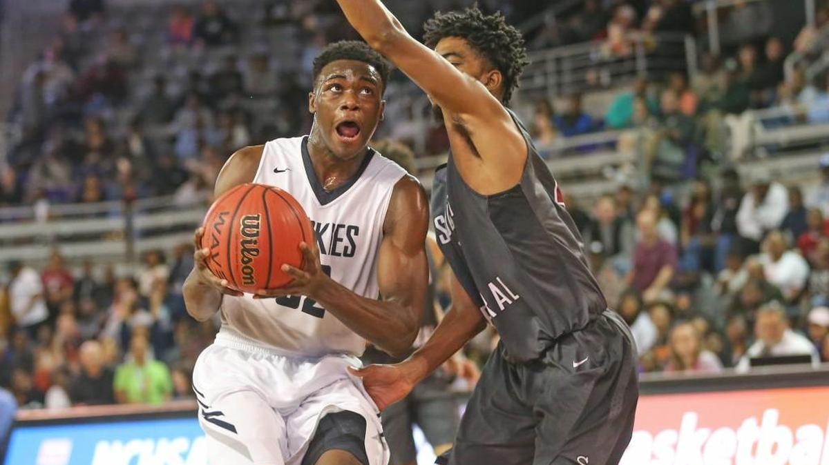 Heritage’s Jarren McAllister (32) goes in for the shot on the fast break as South Central’s Tahj Riddick (2) tries to make the stop. The South Central Falcons and the Heritage Huskies played in the boys 4A Eastern Regional basketball finals at East Carolina University on Saturday, March 3, 2018.