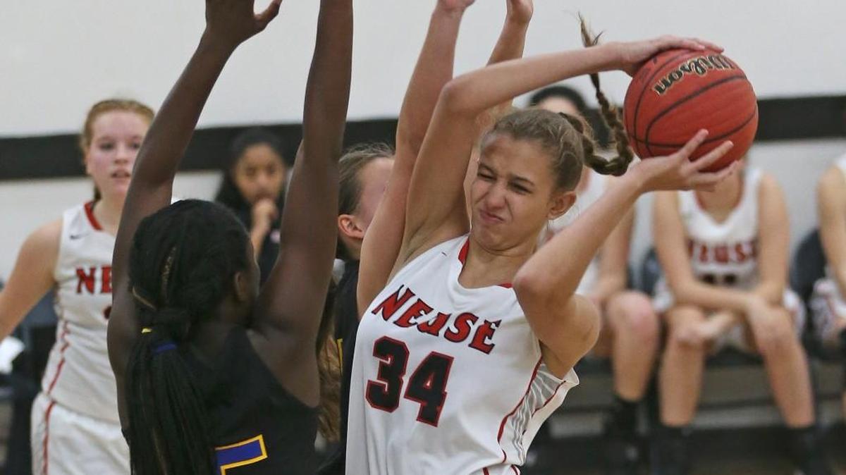 Neuse Christian's Izabel DeAngelo (34) takes down a rebound over Cape Fear's Pyhdel Nwanze (5). Coverage from the prep basketball games between the Neuse Christian Academy Lions and the Cape Fear Christian Academy Eagles played in Raleigh, N.C. on Friday, January 27, 2017. The Neuse Christian Academy Girls defeated Cape Fear Christian Academy 51-27 and the Cape Fear Boys defeated Neuse Christian 102-94.