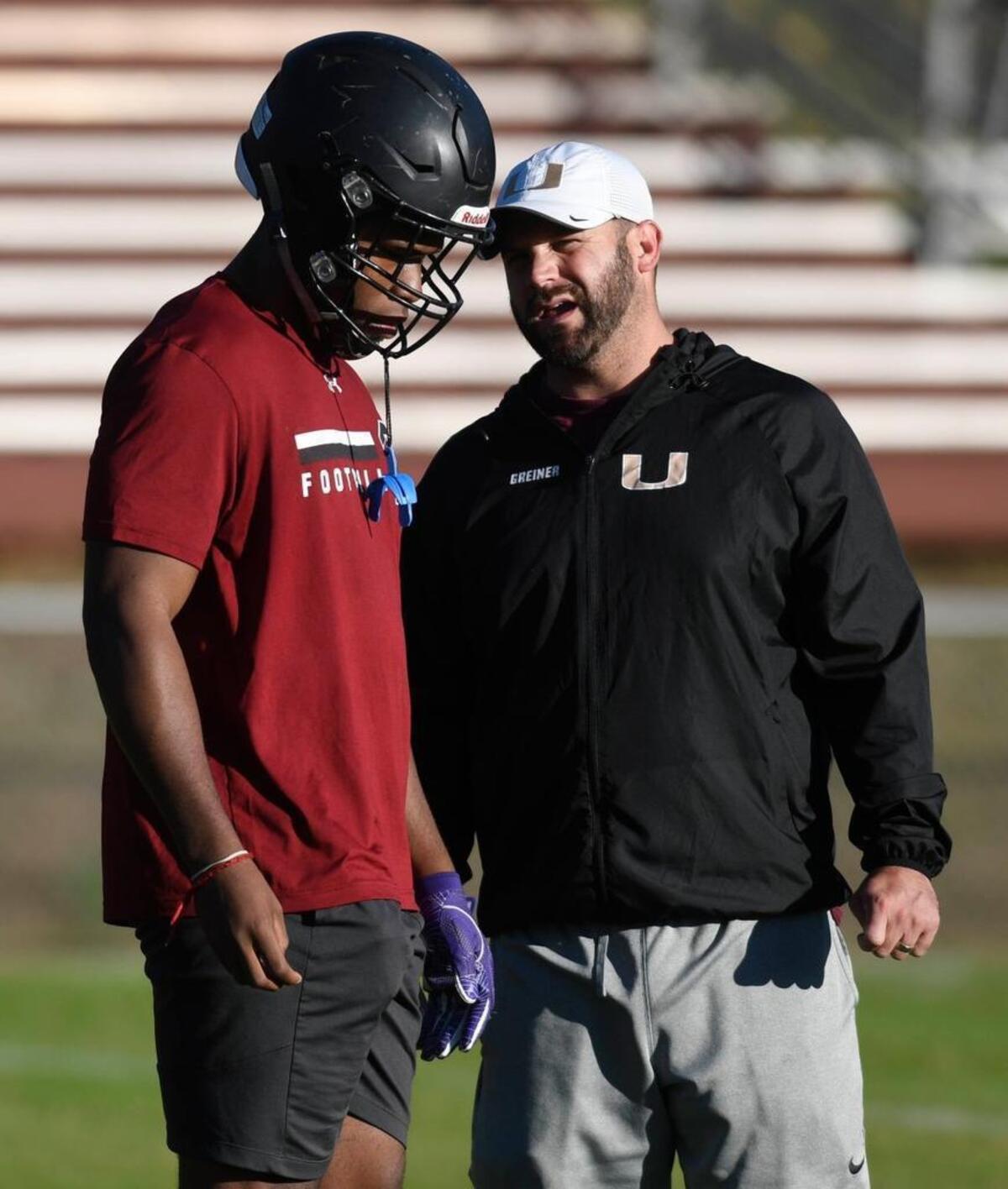 Harding High RB Quavaris Crouch, left, talks with football coach Sam Greiner during practice on Thursday, Nov. 16, 2017.