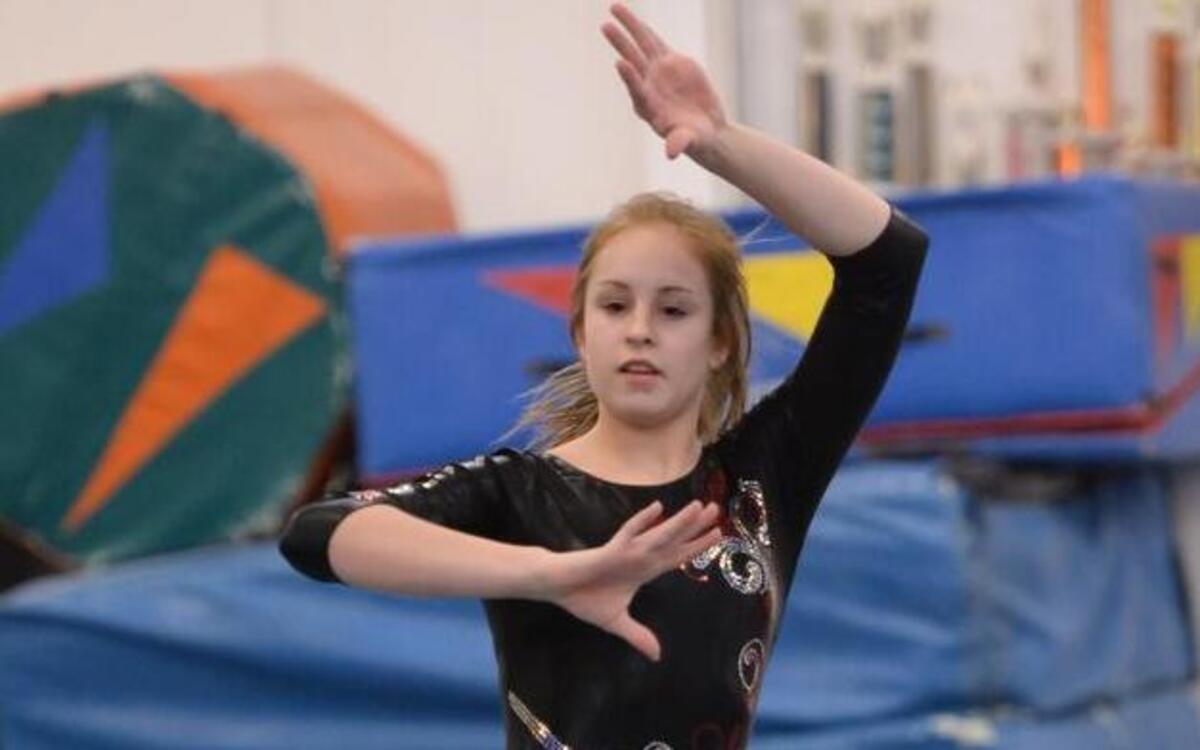 Elizabeth Farin of Middle Creek in the floor competition during the North Carolina High School State Gymnastics Championships in Raleigh, N.C. on Friday, January 30, 2015.