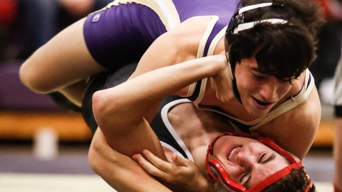 Holly Springs’ Ed Callahan, top, forces Middle Creek's Chris DePerno onto his back for a win their 170lb match via pin in :53 seconds during Middle Creek's wrestling match at Holly Springs on Wednesday, December 16, 2015. Holly Springs won the match 63-10.